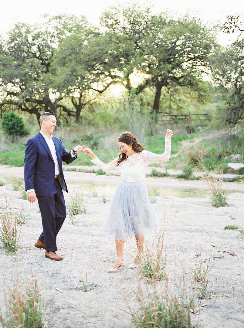 engaged couple dancing together at Bull Creek