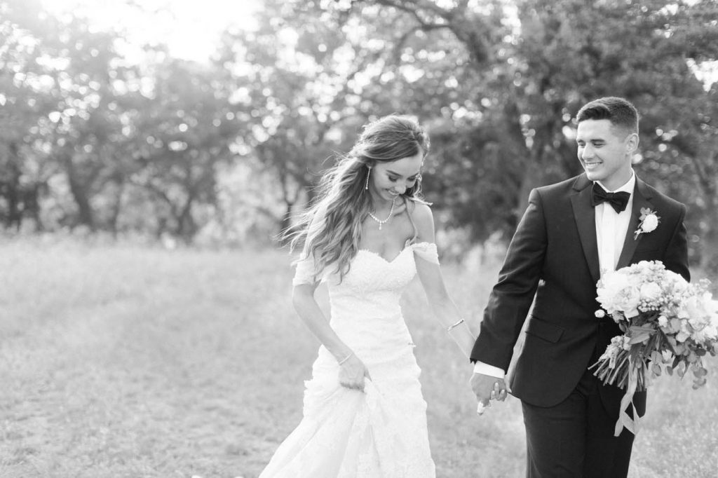 a black and white image of the bride and groom