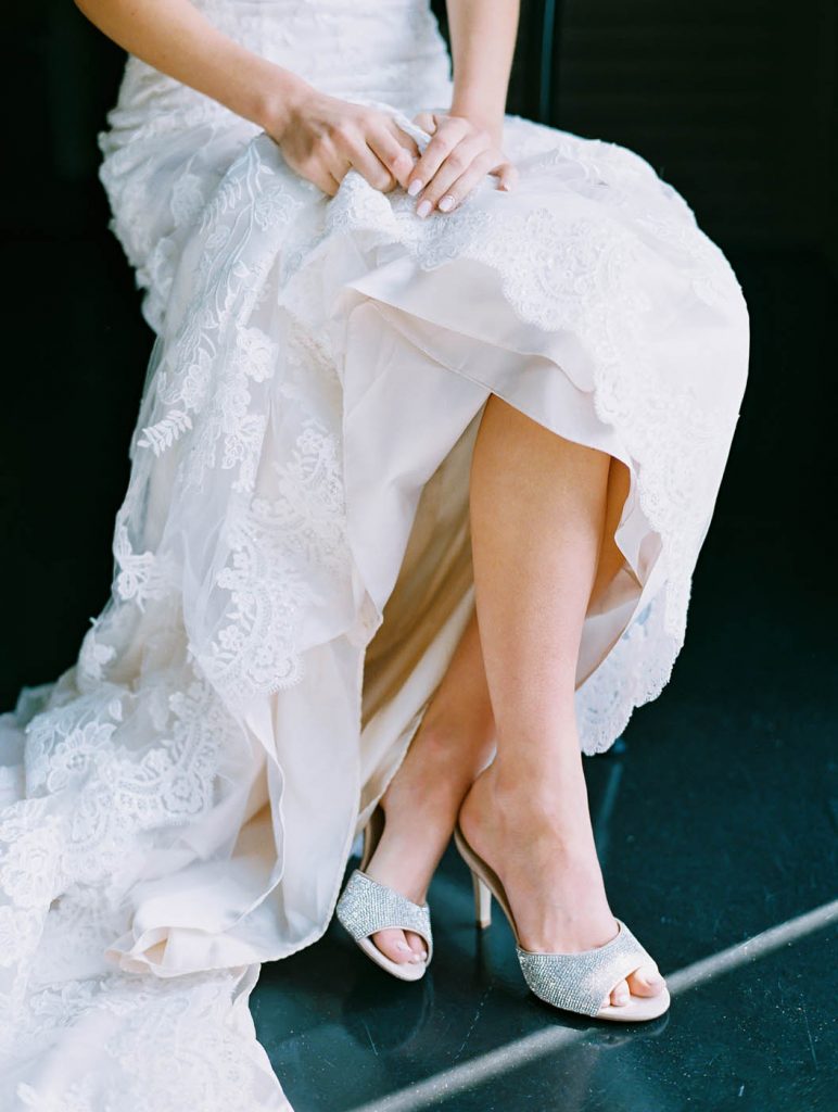 a portrait of the bride's shoes and her train