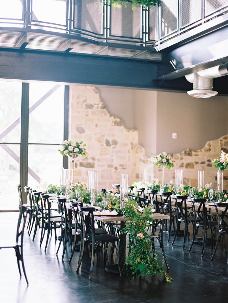 dinner tables at Park 31 with greenery garlands