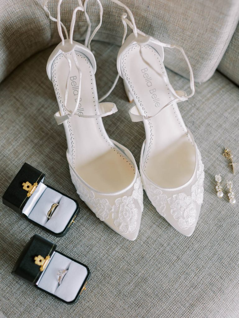 flatlay with bella belle shoes and wedding rings
