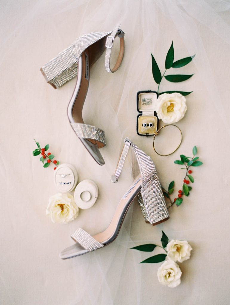 bridal detail flatlay with winter berries
