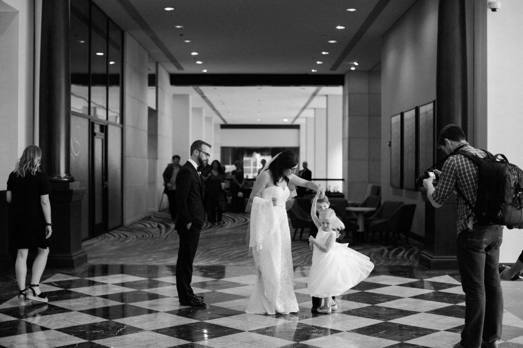 Bride twirls the flower girl at the Worthington Renaissance hotel