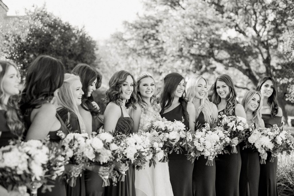 Kennedy and her bridesmaids laugh together