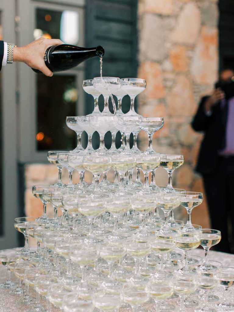 A champagne tower is poured
