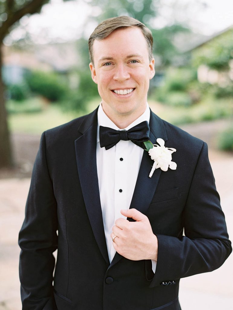 classic groom portrait in black tuxedo
