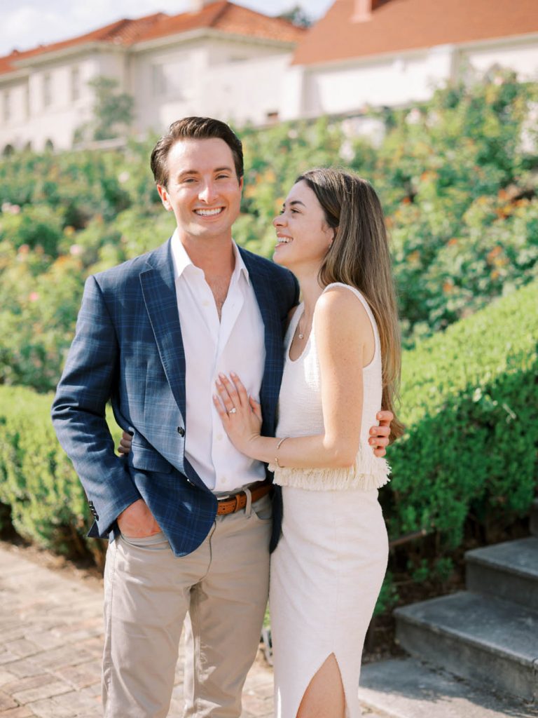 The couple laughs together in the garden of the Commodore Perry