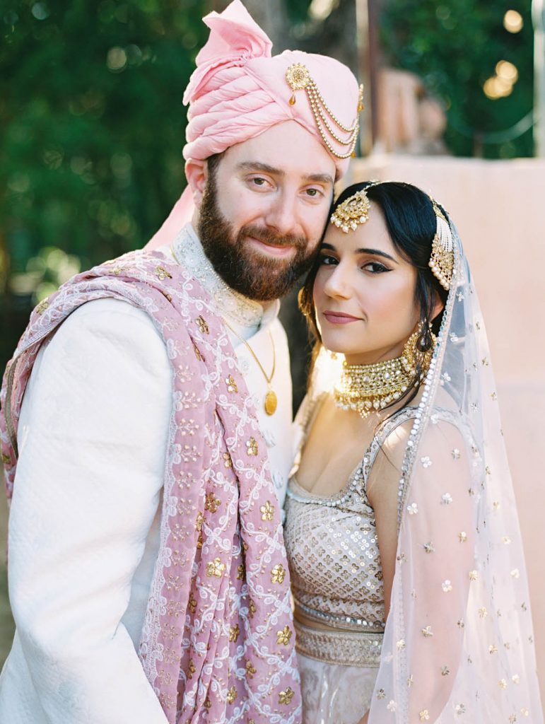 portrait of the bride in her lehenga and the groom in his sherwani