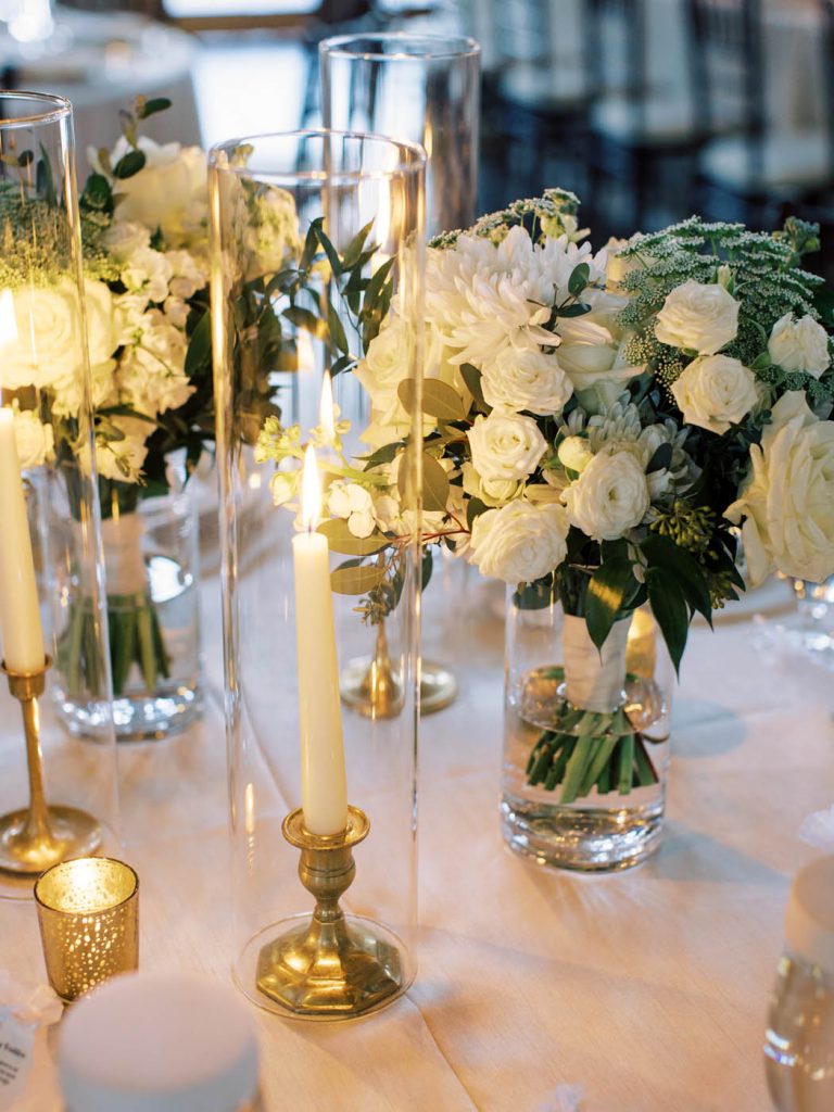 White wedding flowers with taper candles