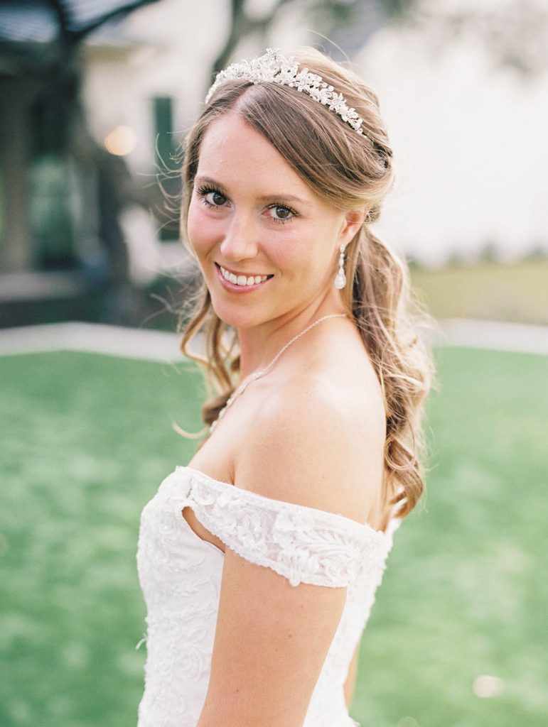 bride wearing a tiara and smiling