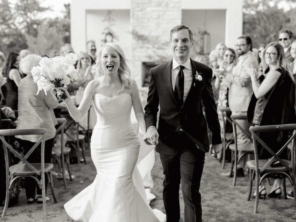 Couple celebrates during the recessional