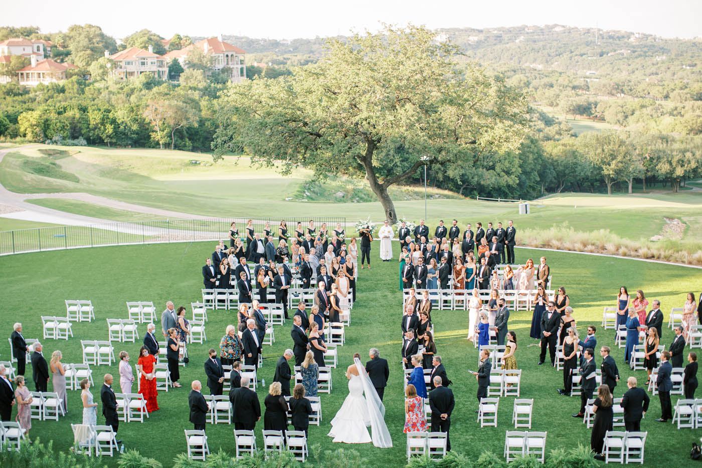overhead photo of a ceremony on the great lawn of omni barton creek
