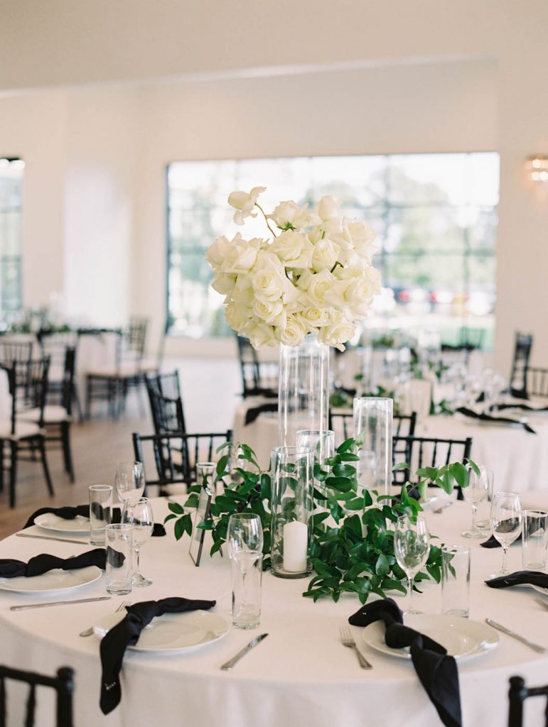 the white tonal centerpiece with roses and orchids