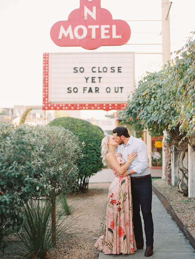 couple poses for a photo outside the Austin Motel on South Congress Avenue