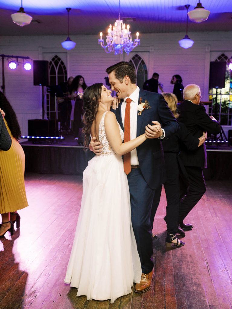the bride and groom dance together inside mercury hall in austin