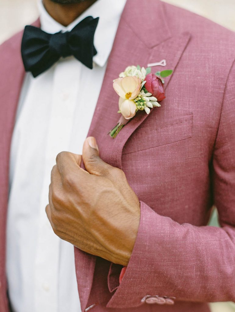 boutonniere on a pink jacket by remi and gold