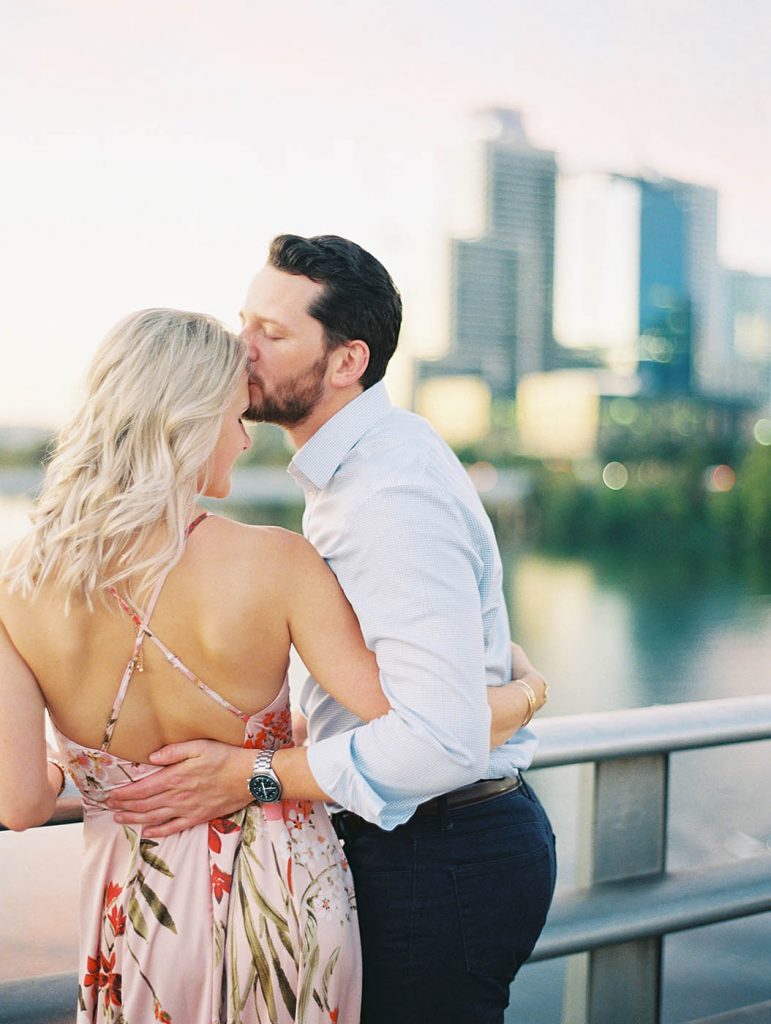 couple kissing on the South Congress bridge