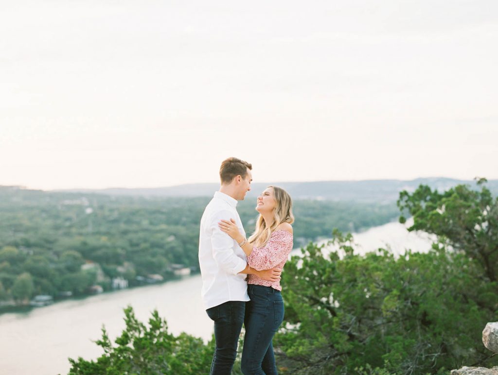 stylish couple posing together at Mount Bonnell in Austin