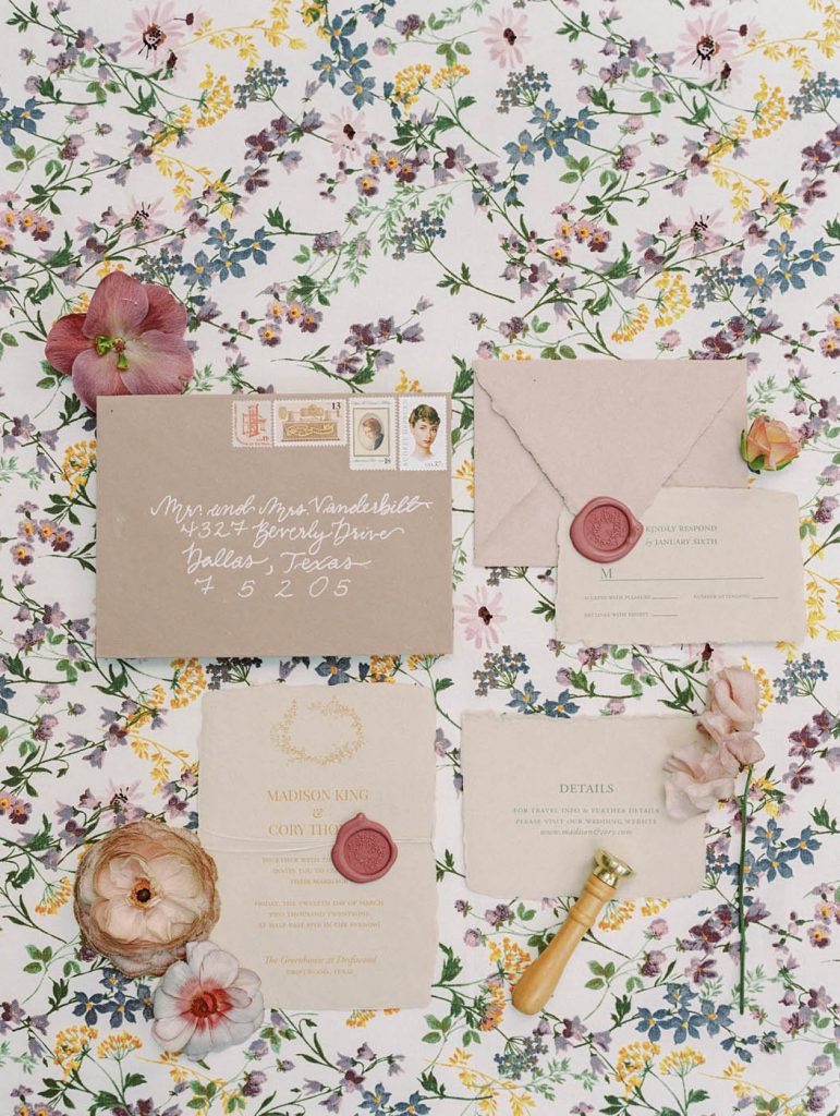 romantic flatlay of a wedding invitation suite by grey meets gold
