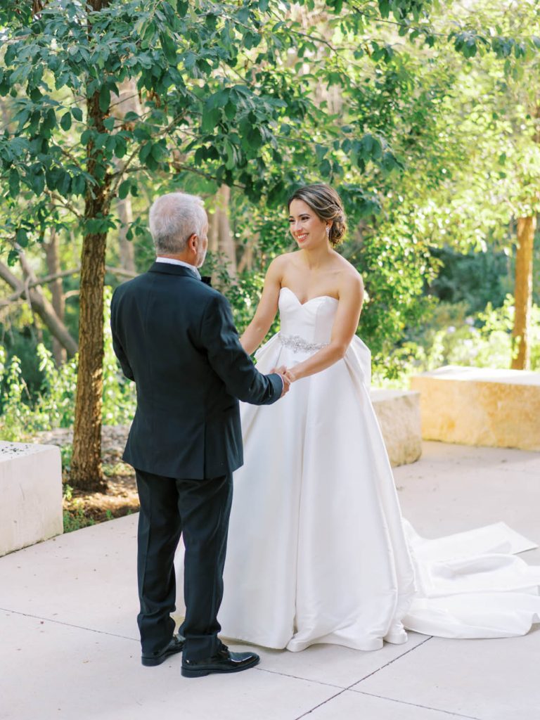 the bride shares a moment with her father