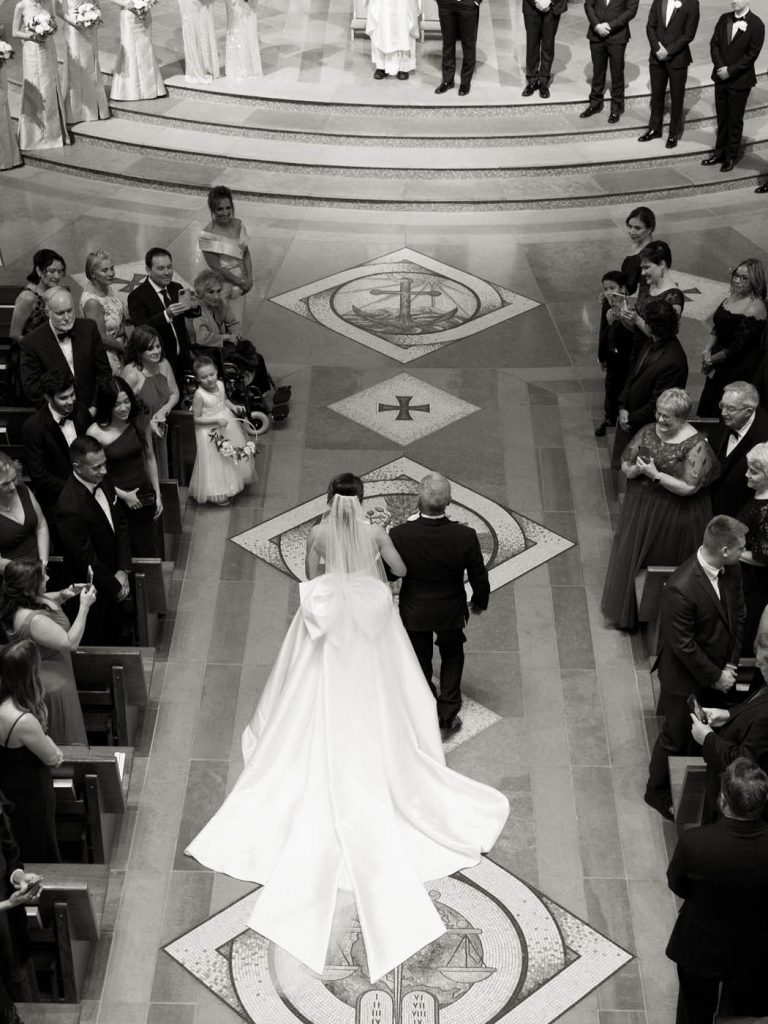 aerial perspective of the bride walking down the aisle