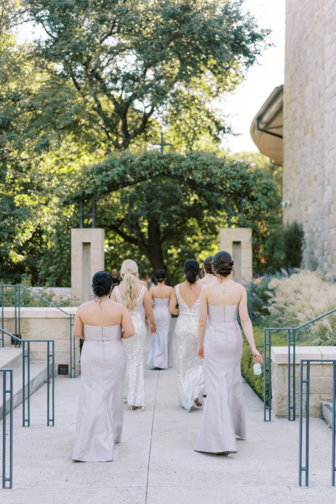 the bridesmaids walk to see the bride at saint john neumann