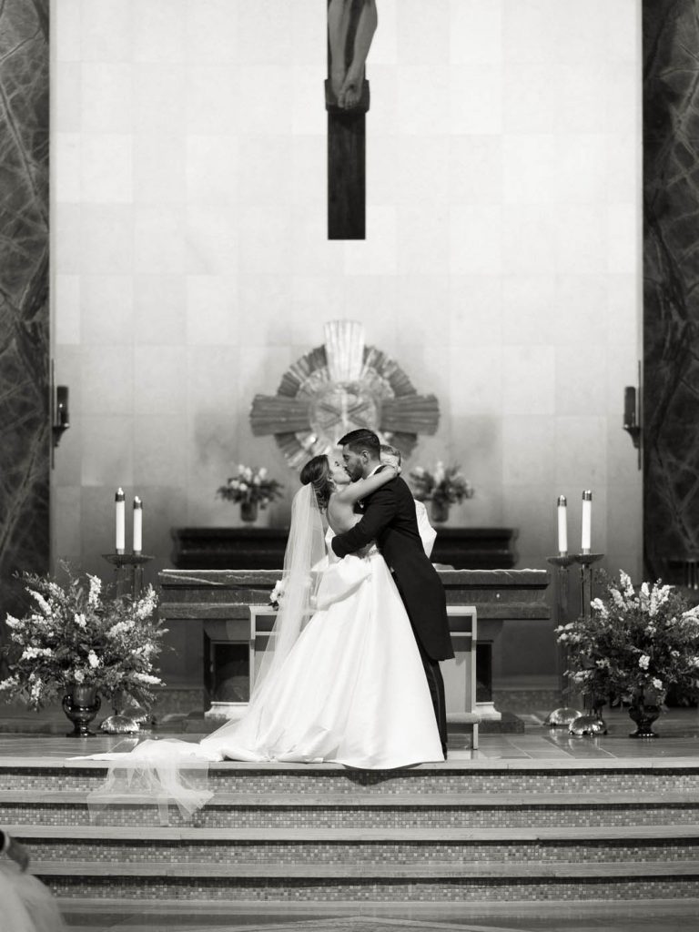 bride and groom first kiss