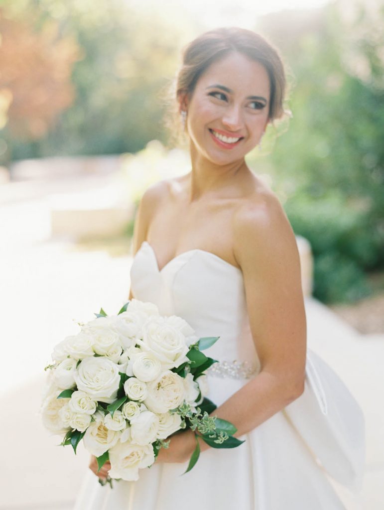 close up portrait of the bride with her bouquet
