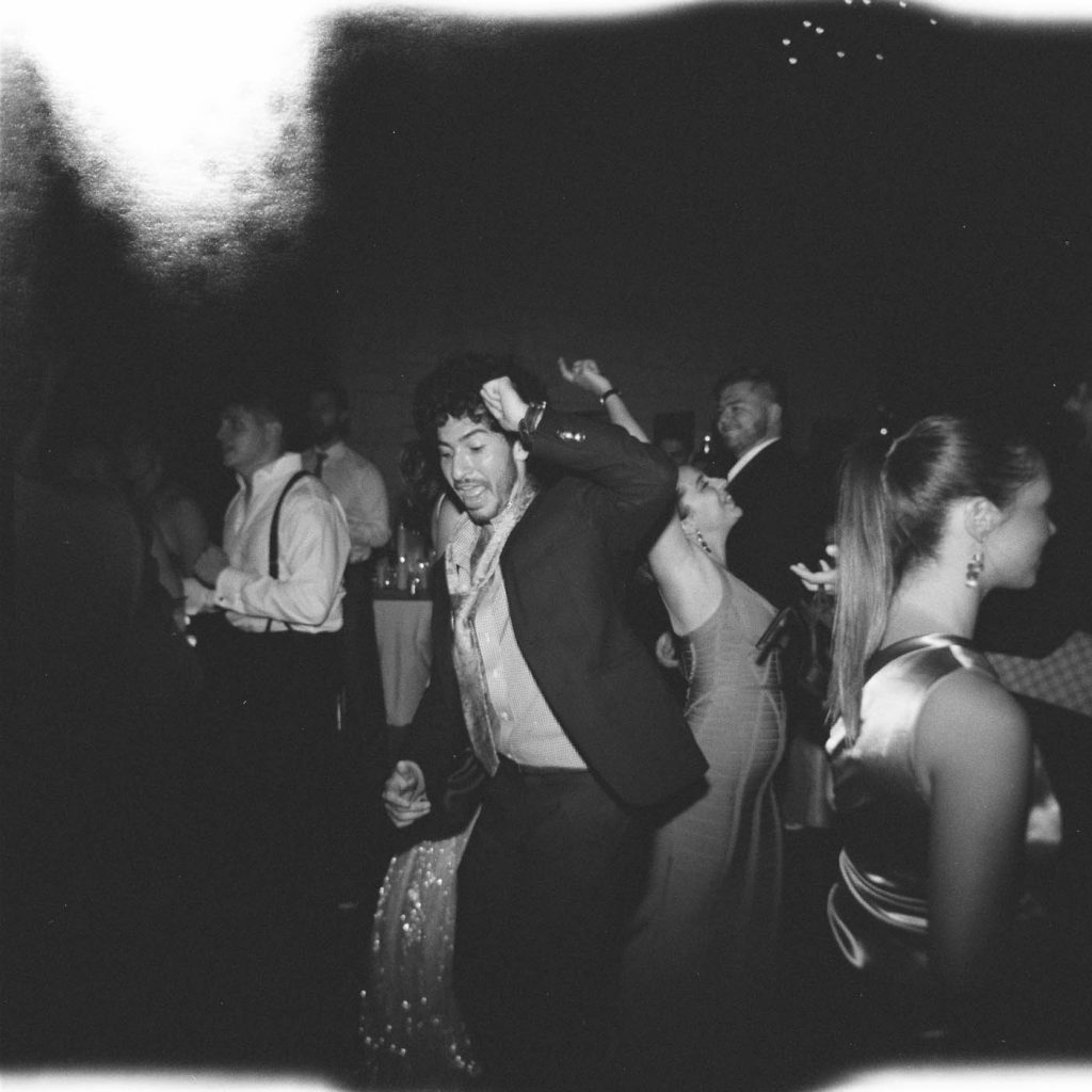 guest dancing at a wedding captured on holga