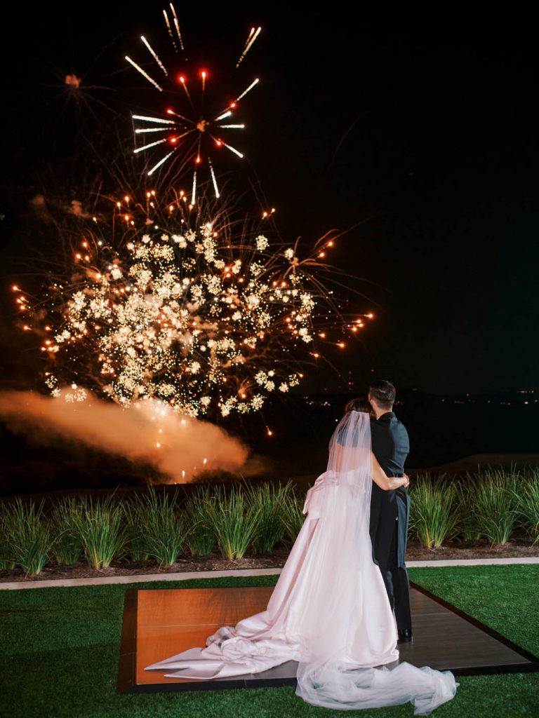 the bride and groom enjoy a fireworks show by big dog pyro