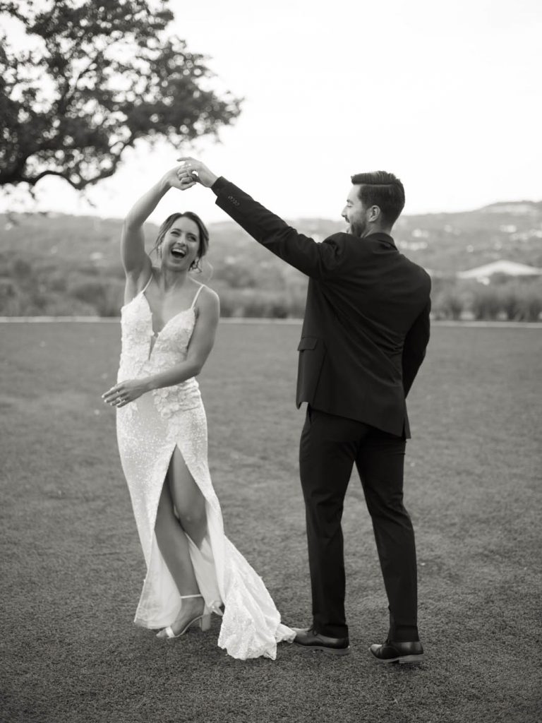 groom twirls the bride