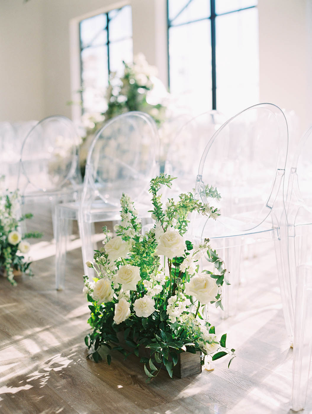 One of the aisle floral pieces for the modern indoor garden ceremony