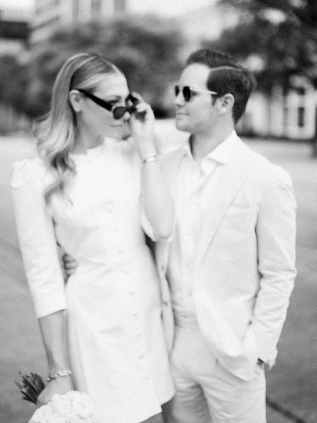 couple wearing sunglasses at their courthouse elopement