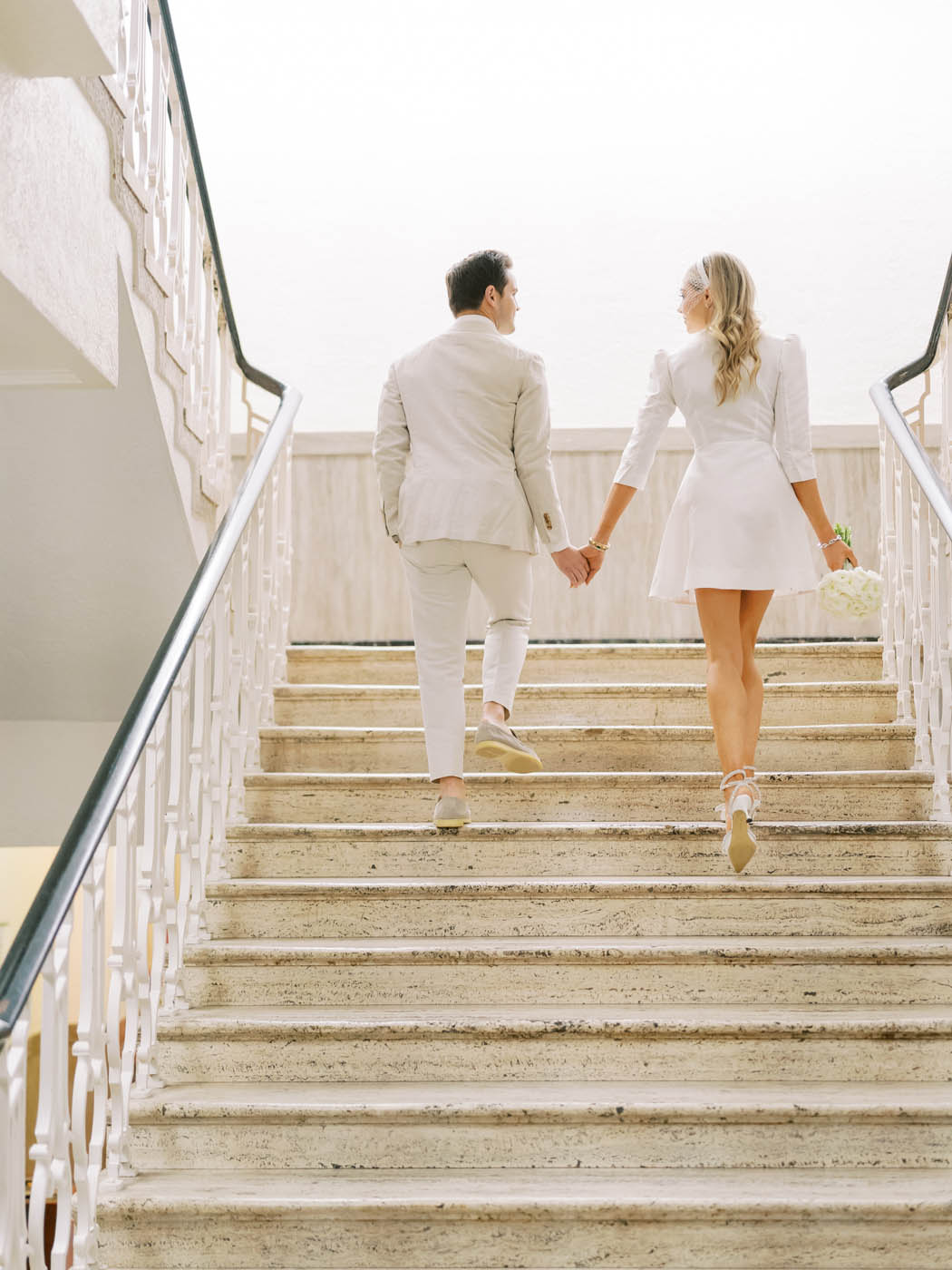 couple walking up stairs at the travis county courthouse