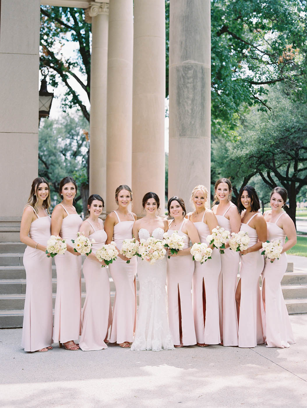 Nikki and her bridesmaids pose for a photo outside Robert Carr chapel